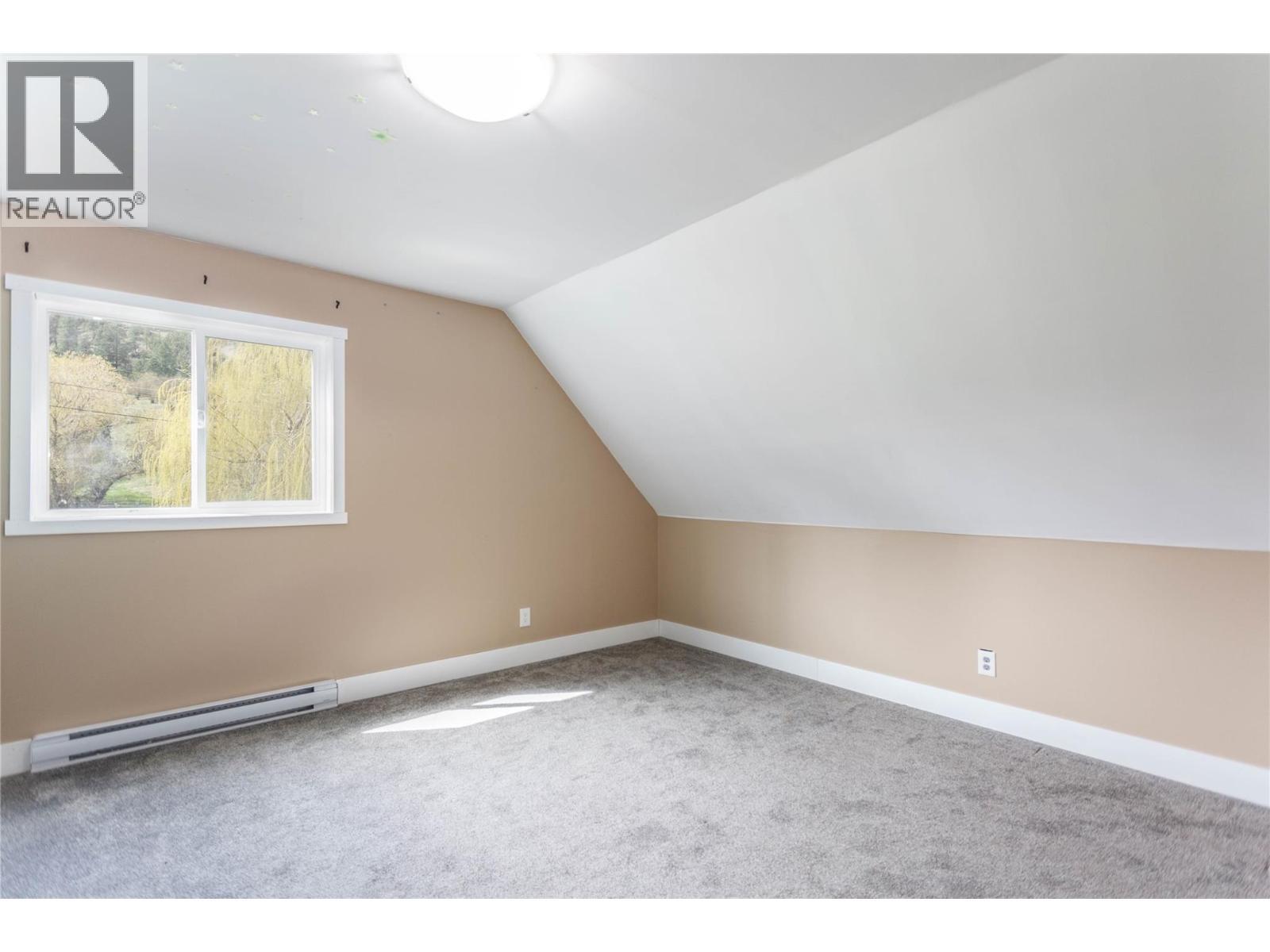 Loft Bedroom 2 - 6655 Cosens Bay Road, Coldstream, BC - Indoor Photo Showing Other Room