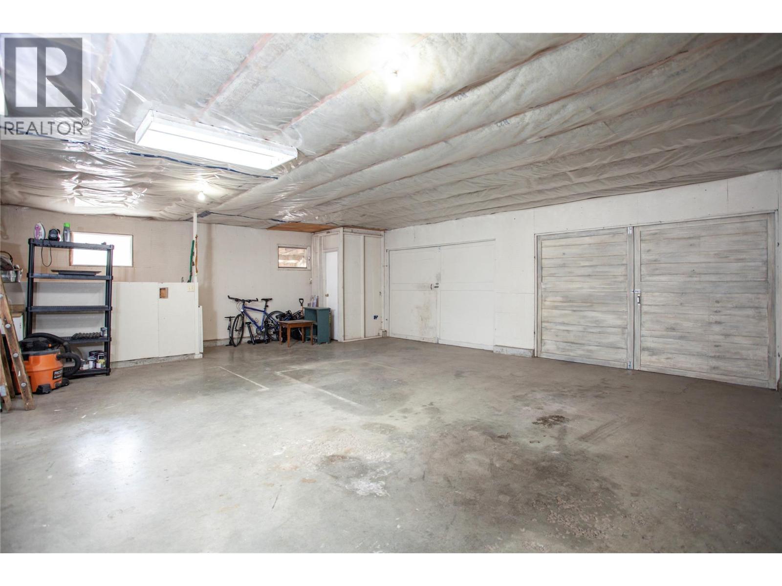 1st Garage Area/Shop - 6655 Cosens Bay Road, Coldstream, BC - Indoor Photo Showing Garage