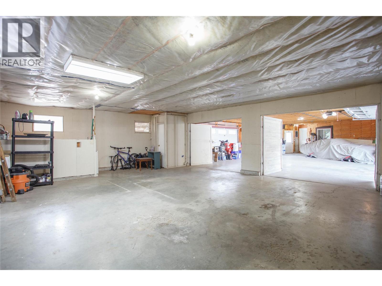 1st Garage Area/Shop - 6655 Cosens Bay Road, Coldstream, BC - Indoor Photo Showing Garage