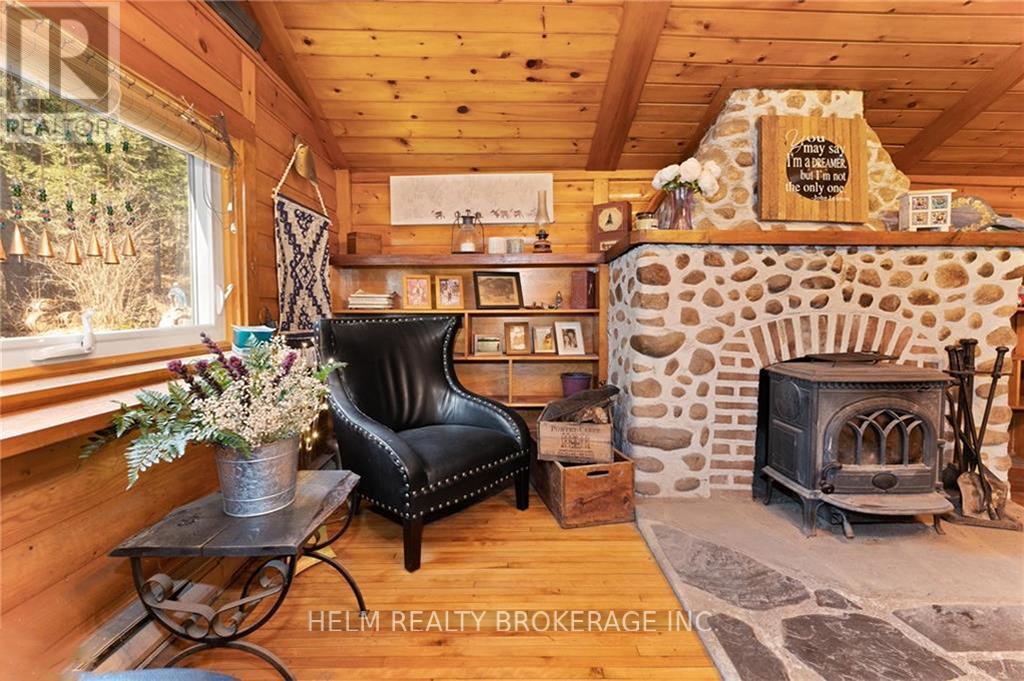 9001 Highway 17 Highway E, Calvin, ON - Indoor Photo Showing Living Room With Fireplace