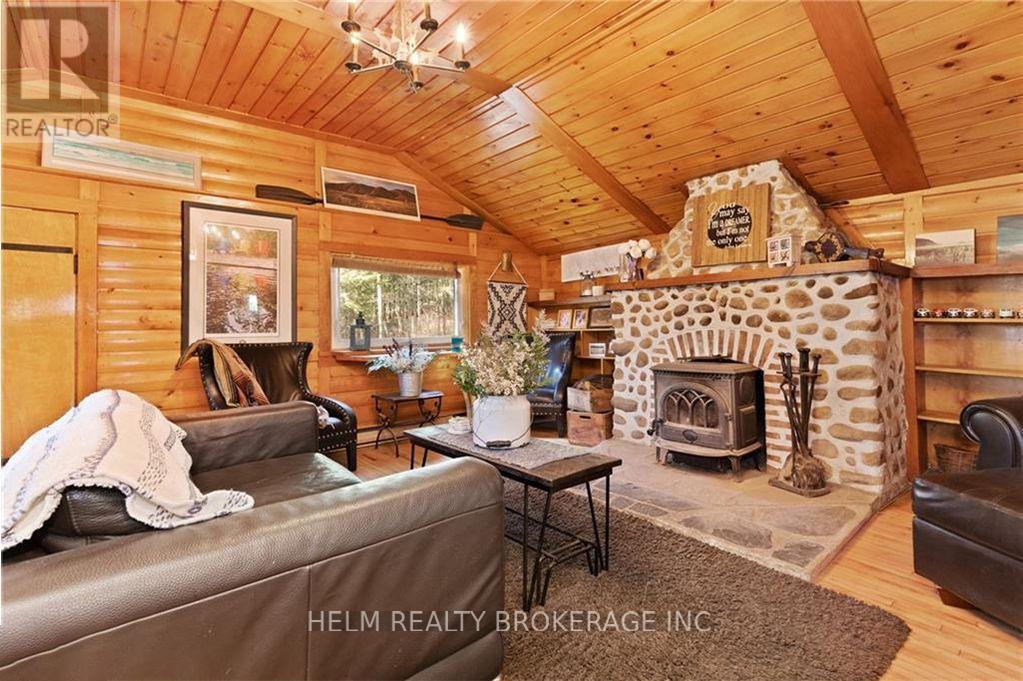 9001 Highway 17 Highway E, Calvin, ON - Indoor Photo Showing Living Room With Fireplace