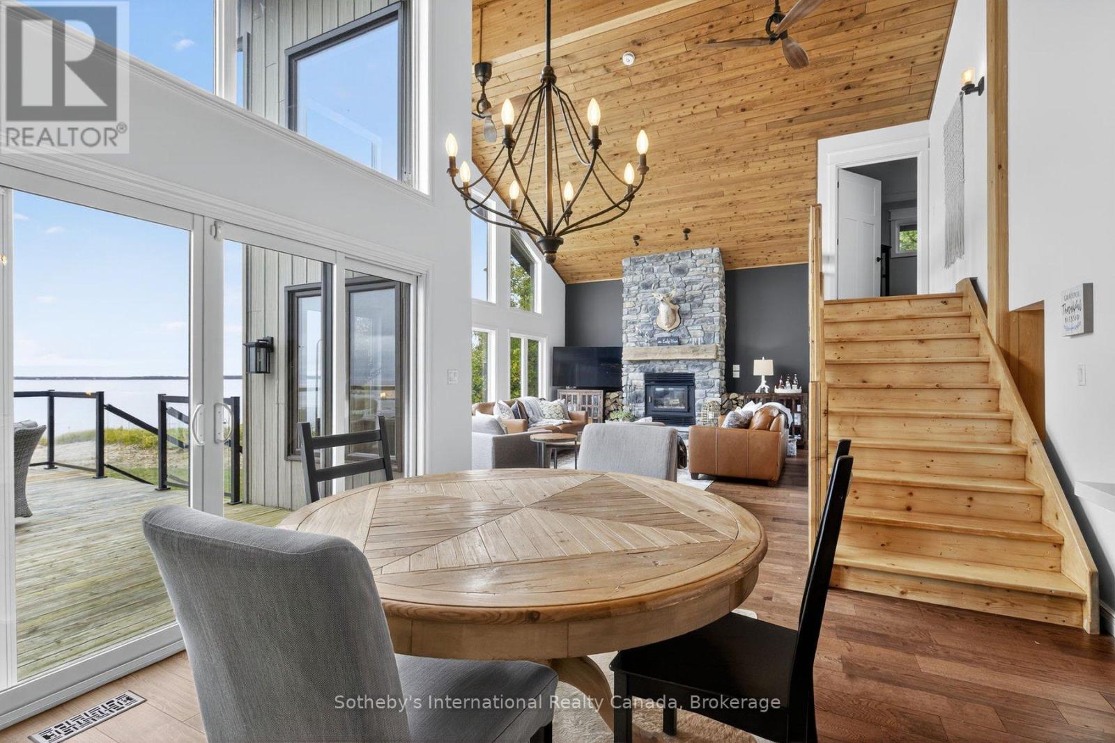 1773 Champlain Road, Tiny, ON - Indoor Photo Showing Dining Room With Fireplace
