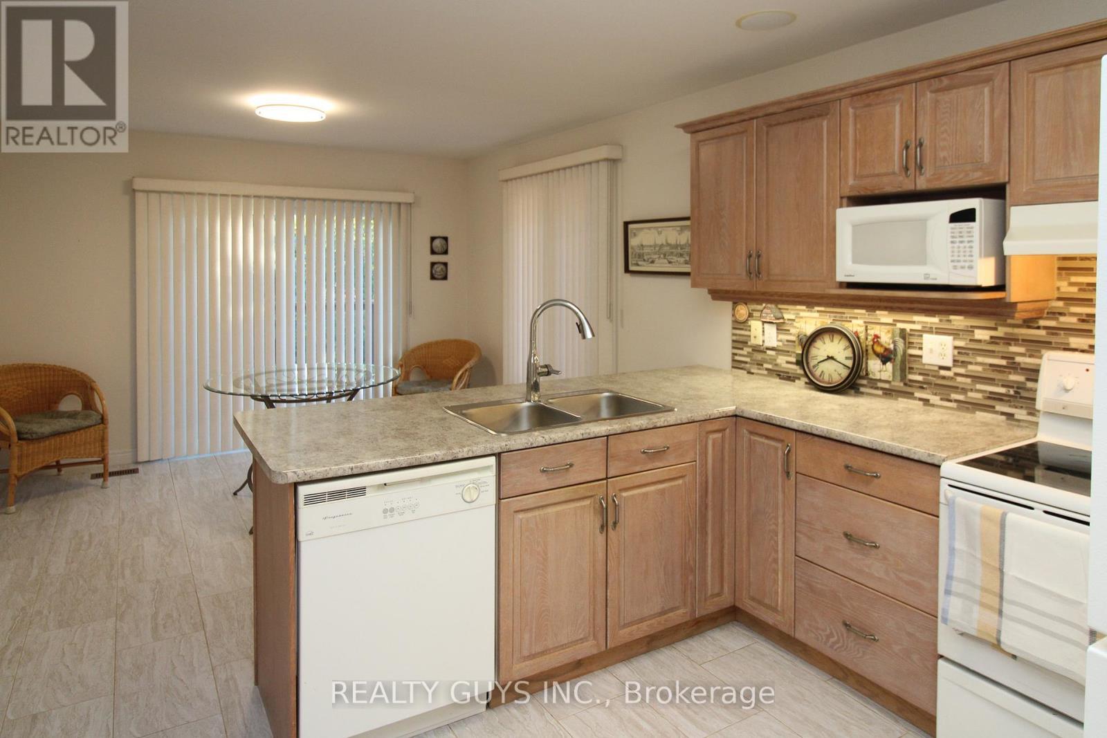233 Odette Road, Peterborough (Monaghan Ward 2), ON - Indoor Photo Showing Kitchen With Double Sink