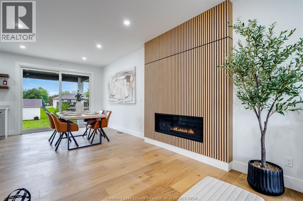 8319 Annie, Mcgregor, ON - Indoor Photo Showing Other Room With Fireplace