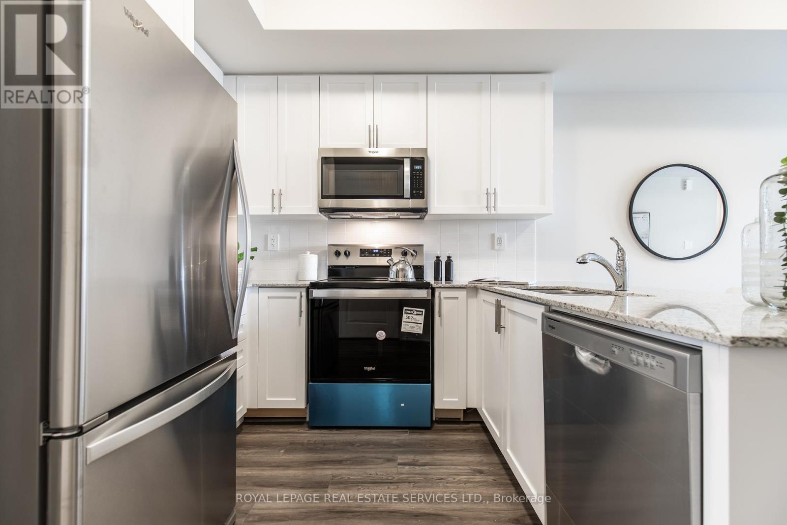 112 - 1597 Rose Way, Milton, ON - Indoor Photo Showing Kitchen With Stainless Steel Kitchen