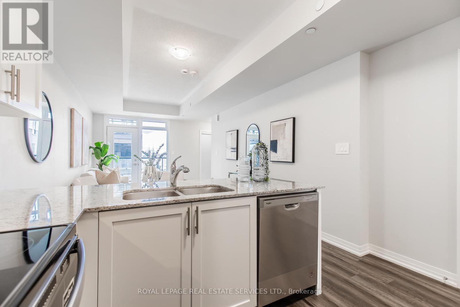 112 - 1597 Rose Way, Milton, ON - Indoor Photo Showing Kitchen With Double Sink