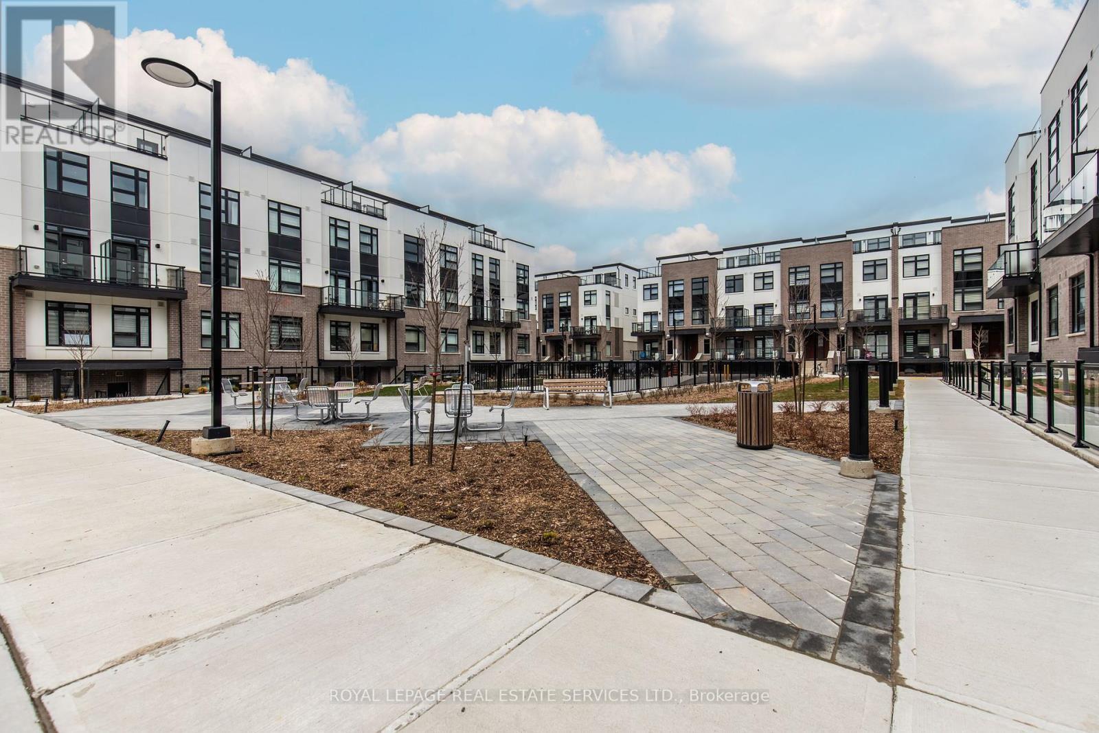 112 - 1597 Rose Way, Milton, ON - Outdoor With Facade