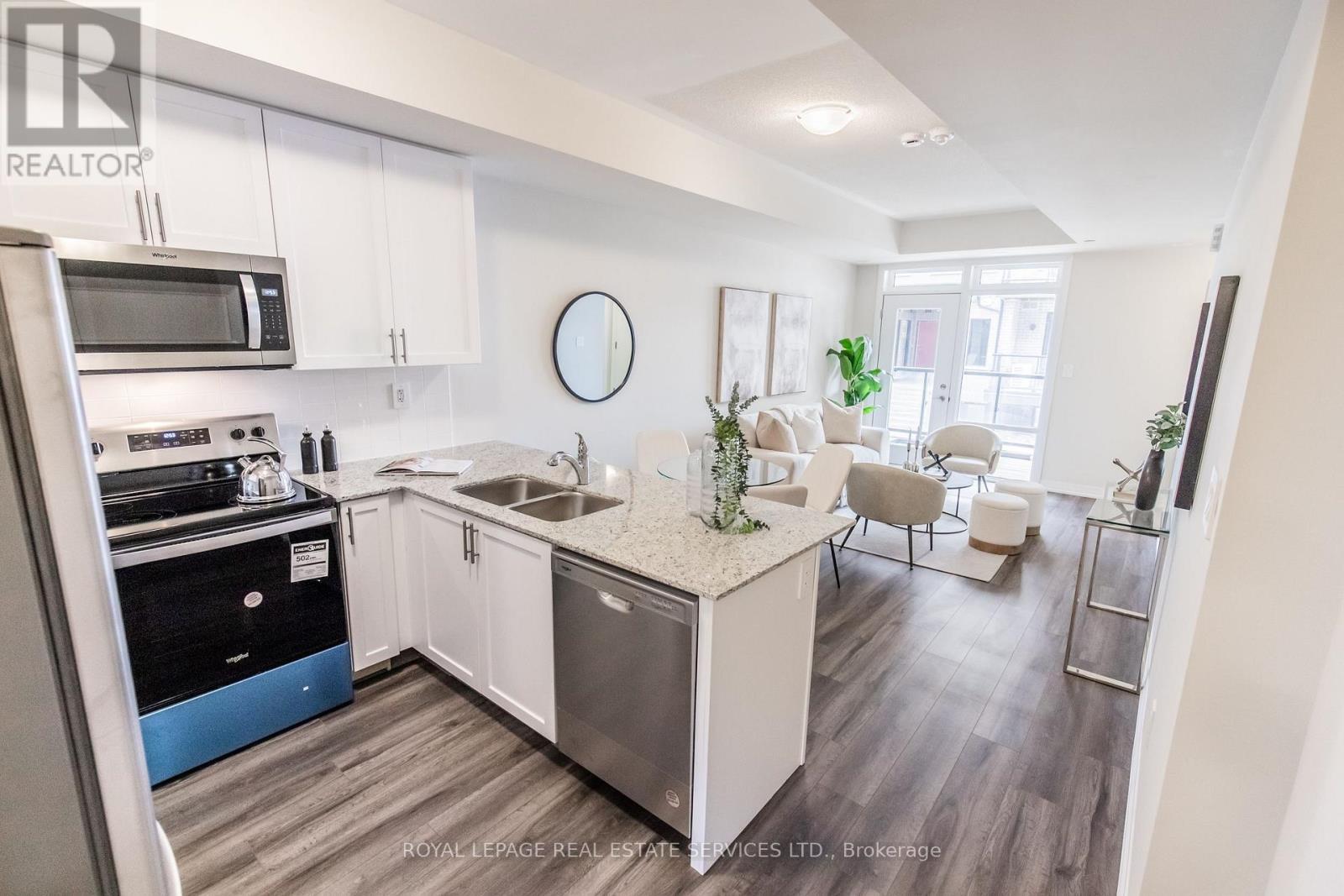 112 - 1597 Rose Way, Milton, ON - Indoor Photo Showing Kitchen With Stainless Steel Kitchen With Double Sink With Upgraded Kitchen