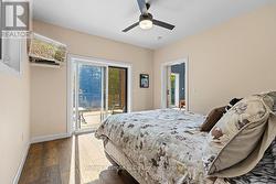 Riverfront primary bedroom with balcony -