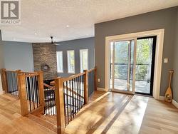 Upper loft area with access to waterfront balcony -