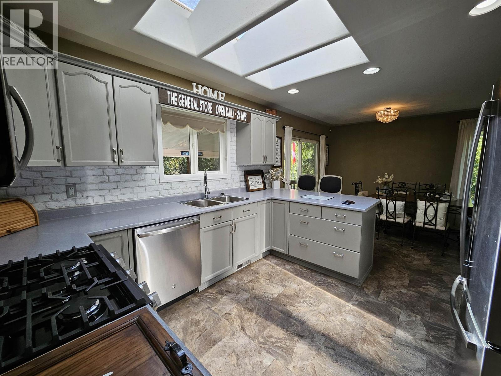 4887 Meesquono Trail, 108 Mile Ranch, BC - Indoor Photo Showing Kitchen With Double Sink