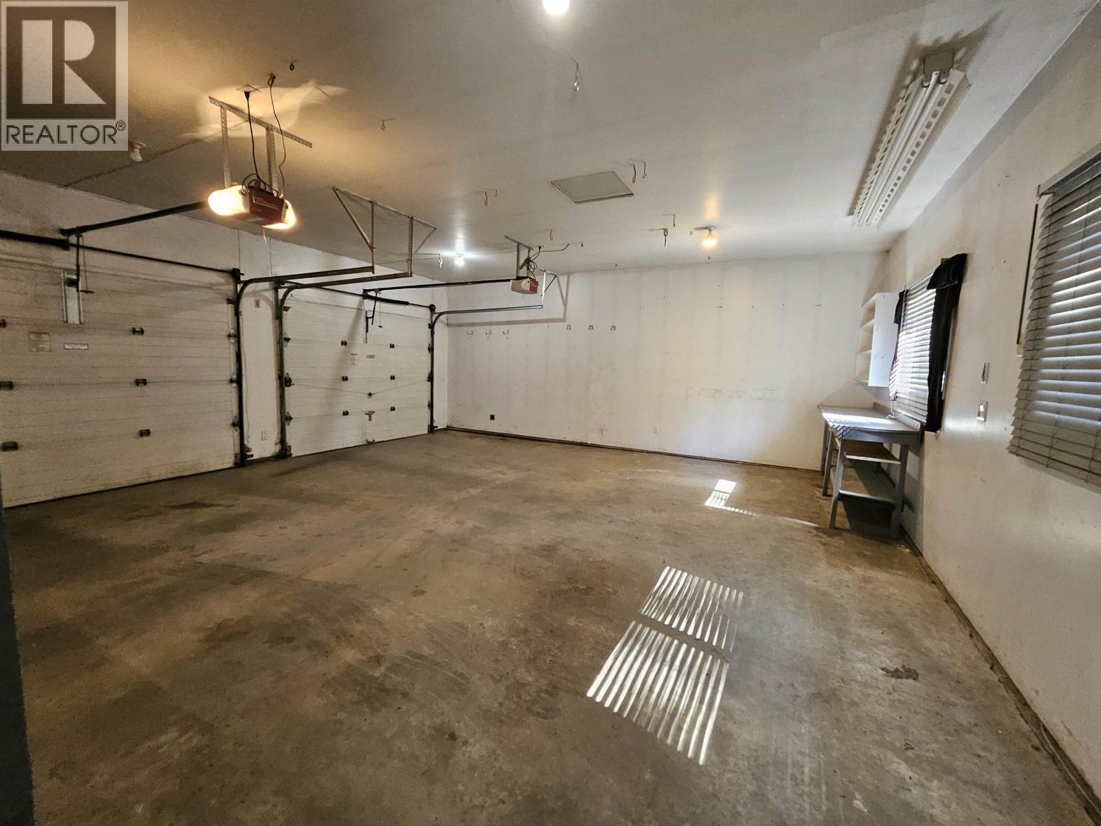 4887 Meesquono Trail, 108 Mile Ranch, BC - Indoor Photo Showing Garage