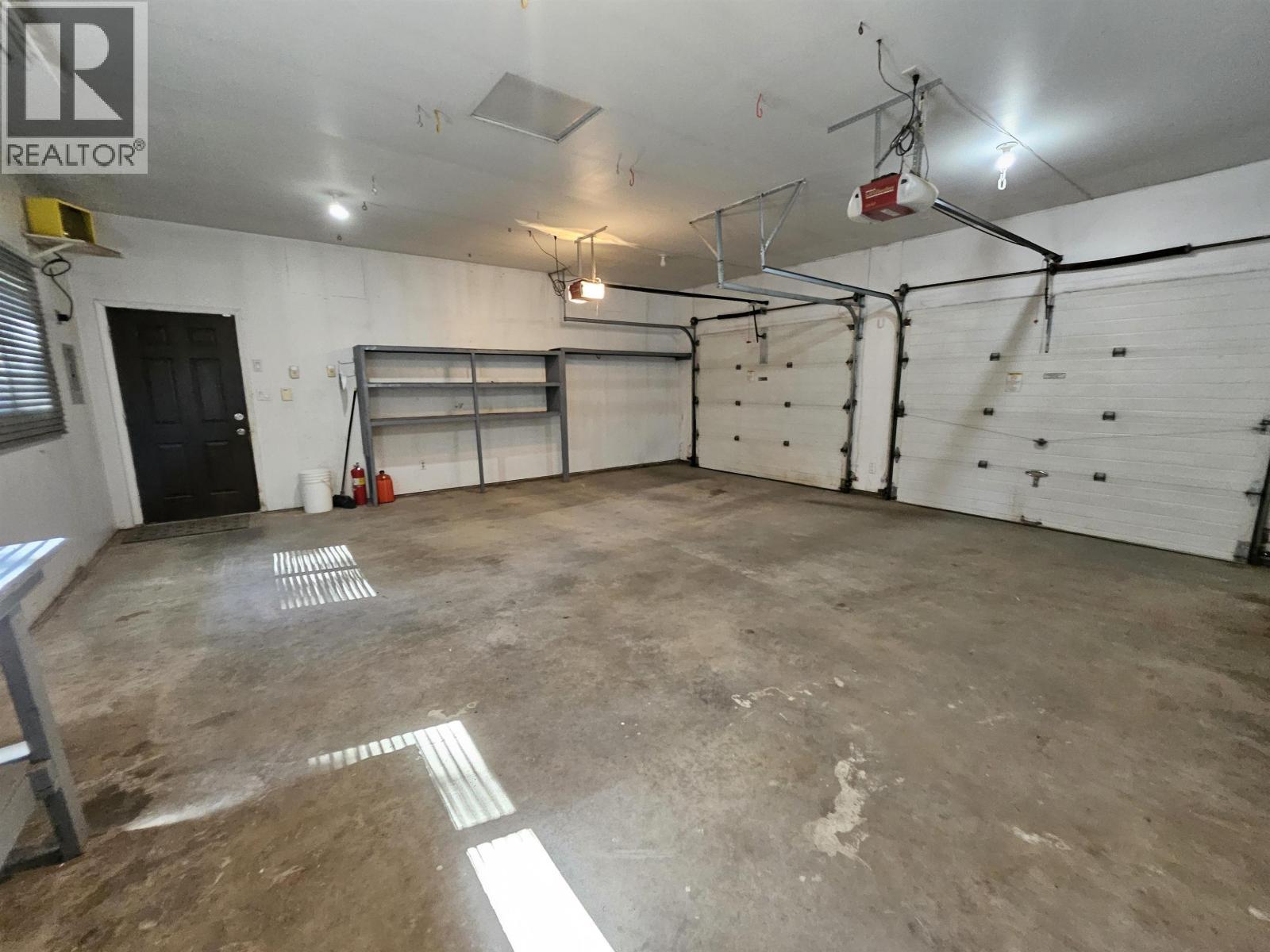 4887 Meesquono Trail, 108 Mile Ranch, BC - Indoor Photo Showing Garage