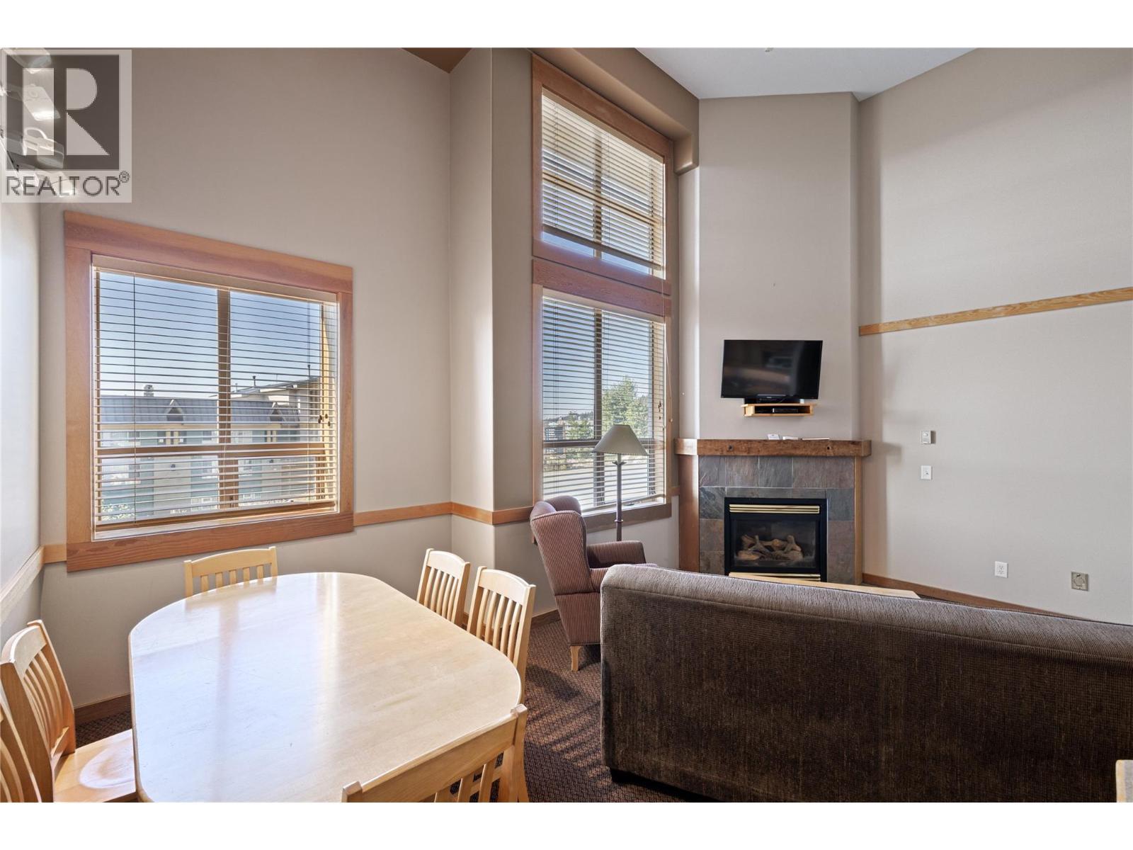 5335 Big White Road Unit# 206, Big White, BC - Indoor Photo Showing Dining Room With Fireplace