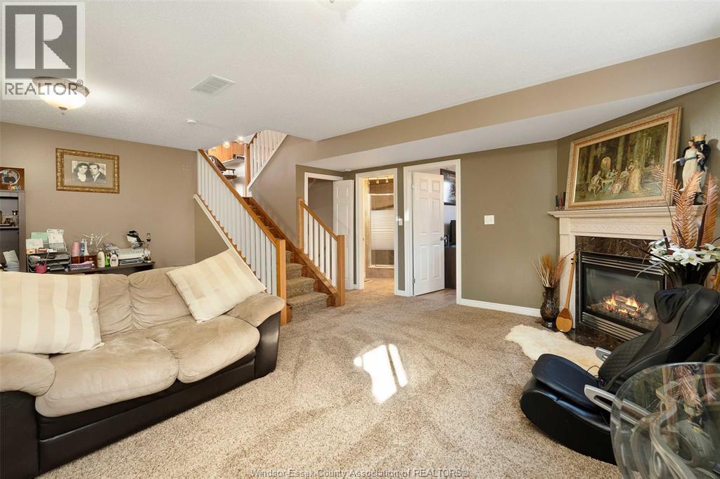4530 Sassafras, Windsor, ON - Indoor Photo Showing Living Room With Fireplace