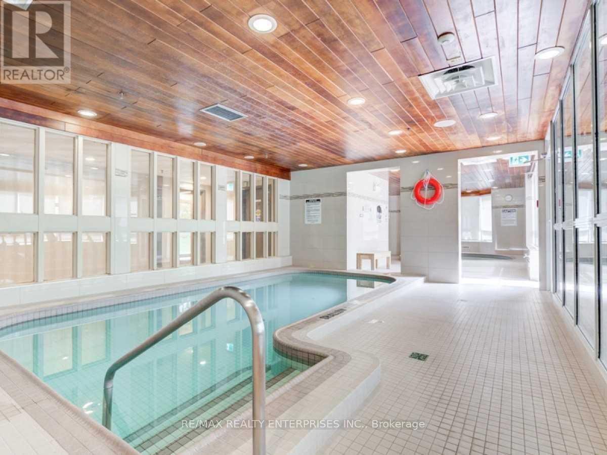 420 - 1001 Cedarglen Gate, Mississauga, ON - Indoor Photo Showing Other Room With In Ground Pool