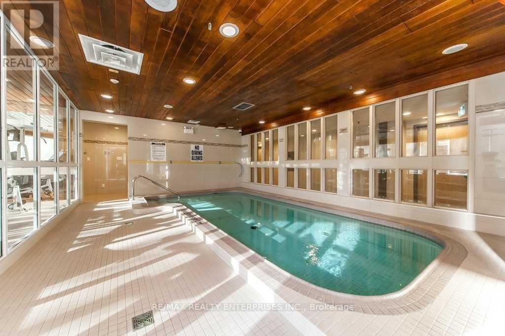 420 - 1001 Cedarglen Gate, Mississauga, ON - Indoor Photo Showing Other Room With In Ground Pool