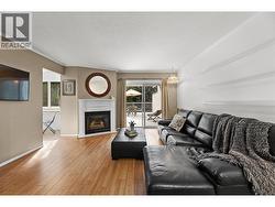 Bright living/dining room featuring a gas fireplace -