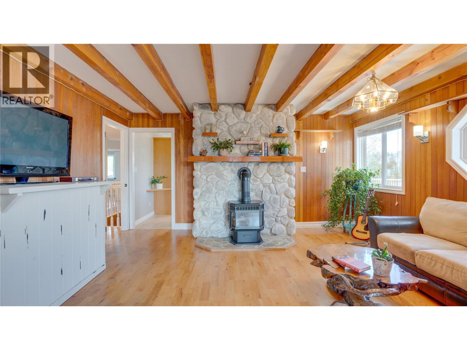 353 Gunter-Ellison Road, Enderby, BC - Indoor Photo Showing Living Room With Fireplace