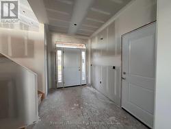 Foyer w/ entry to Garage -