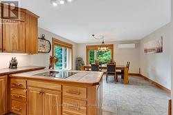 Ceramic flooring flows from dining area to kitchen -