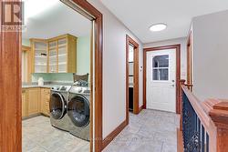 Laundry room off back foyer -