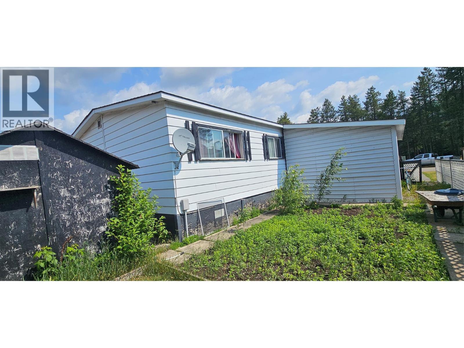 Back view of the carport - 395 Red Cedar Crescent, Sparwood, BC