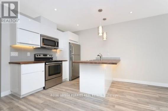 3 - 3411 Lake Shore Boulevard W, Toronto, ON - Indoor Photo Showing Kitchen With Stainless Steel Kitchen