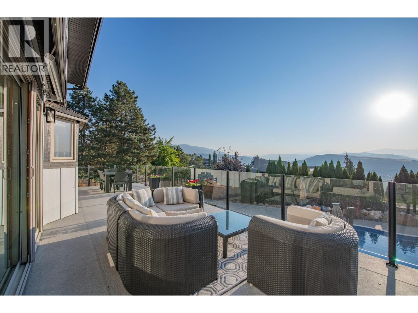 Views for days - 702 Cypress Drive, Coldstream, BC - Outdoor With Deck Patio Veranda