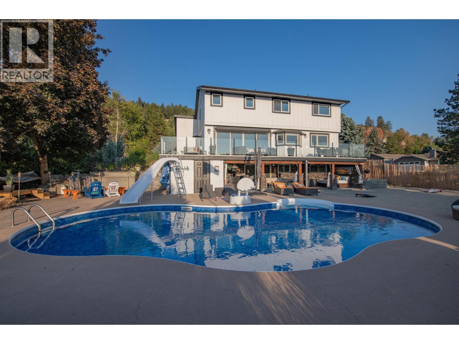 702 Cypress Drive, Coldstream, BC - Outdoor With In Ground Pool With Deck Patio Veranda With Backyard