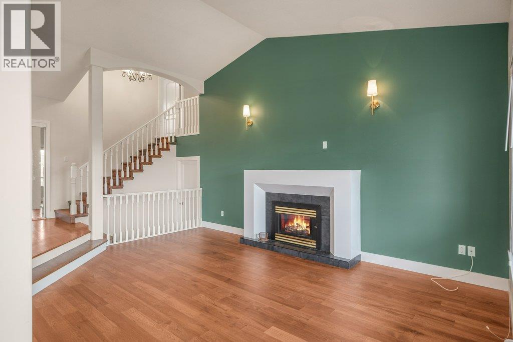 New fireplace and flooring - 974 Mt. Beaven Place, Vernon, BC - Indoor Photo Showing Living Room With Fireplace