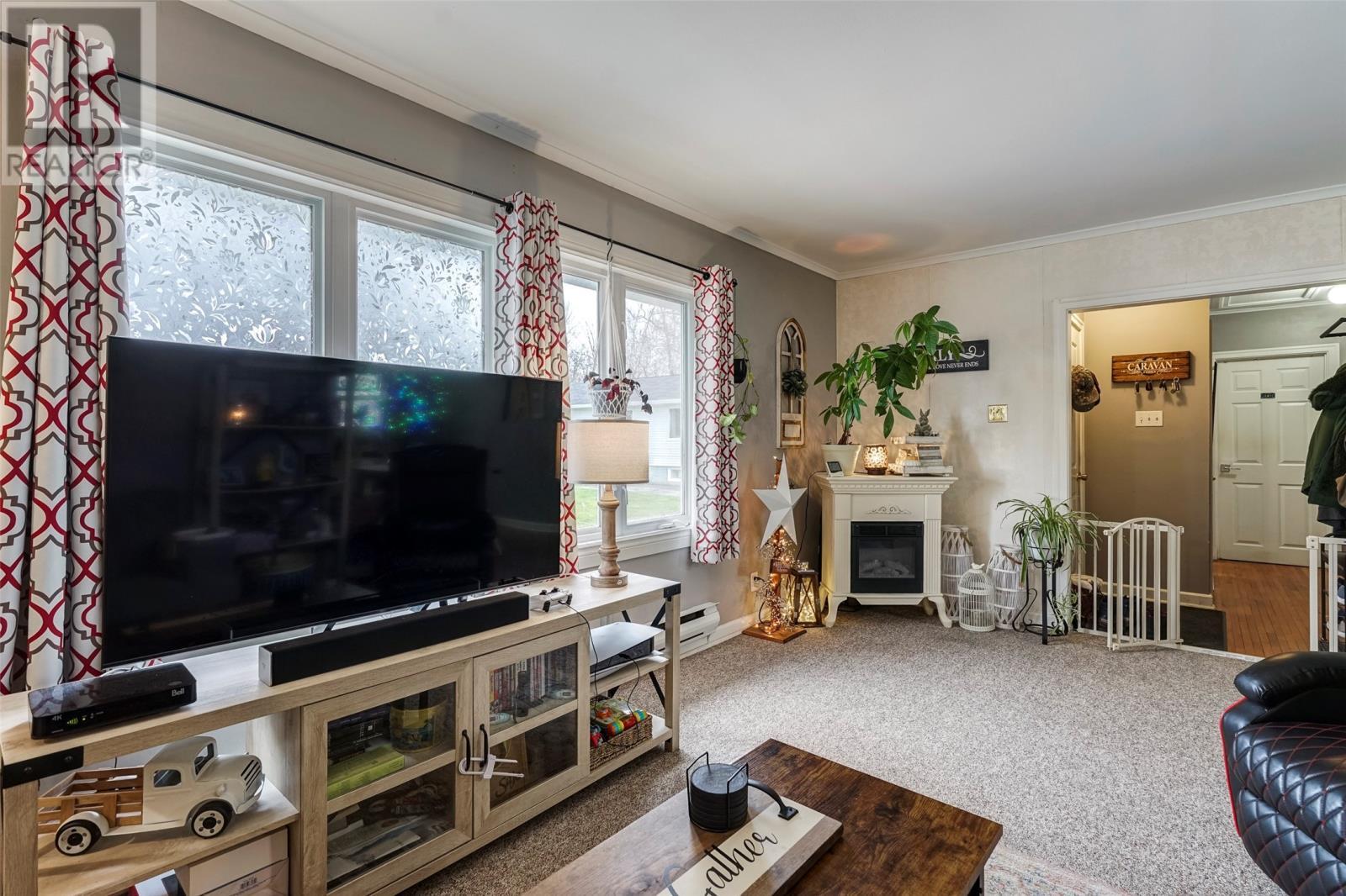 4 Bay Street, Carbonear, NL - Indoor Photo Showing Living Room With Fireplace