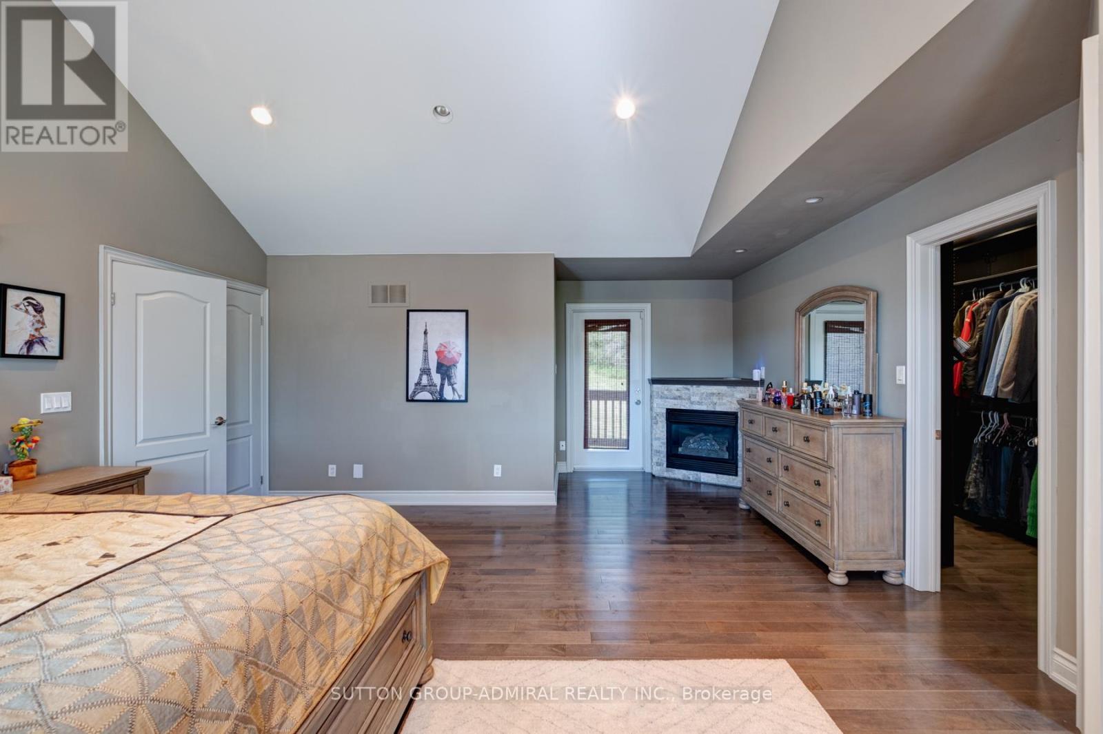 70 Kilkenny Trail, Bradford West Gwillimbury, ON - Indoor Photo Showing Bedroom With Fireplace
