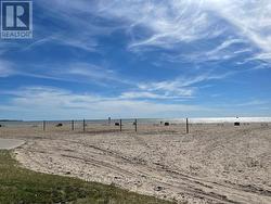 Public Beach with volleyball nets and picnic areas -