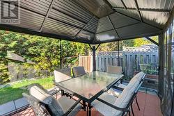 Hard top gazebo in back yard -