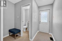 Entrance foyer & access to powder room -