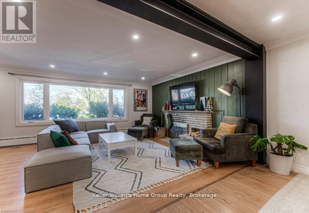 16A - 1085 Queens Boulevard, Kitchener, ON - Indoor Photo Showing Living Room With Fireplace