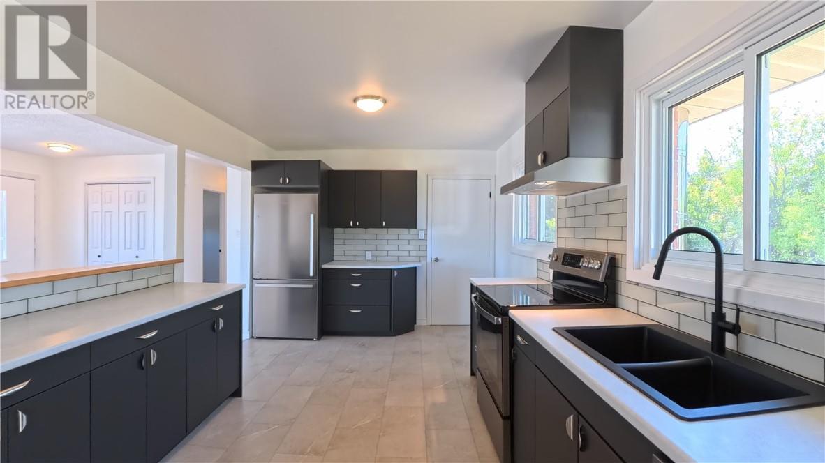 69 Robinson Street W, Little Current, ON - Indoor Photo Showing Kitchen With Double Sink