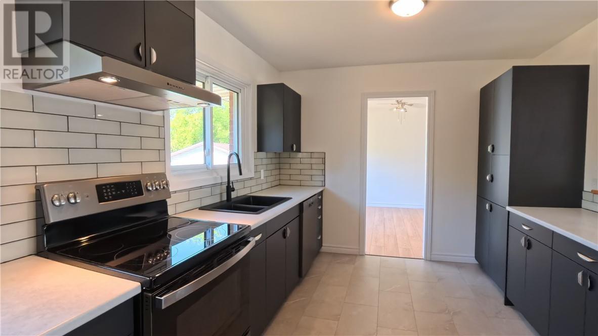 69 Robinson Street W, Little Current, ON - Indoor Photo Showing Kitchen With Double Sink