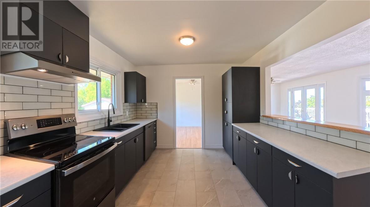 69 Robinson Street W, Little Current, ON - Indoor Photo Showing Kitchen With Double Sink