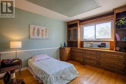 The 2nd main flr bedroom with beautiful built-ins. -