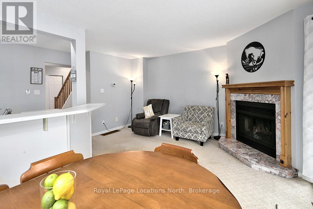 Open concept main living space - 38 - 146 Settlers Way, Blue Mountains, ON - Indoor Photo Showing Living Room With Fireplace