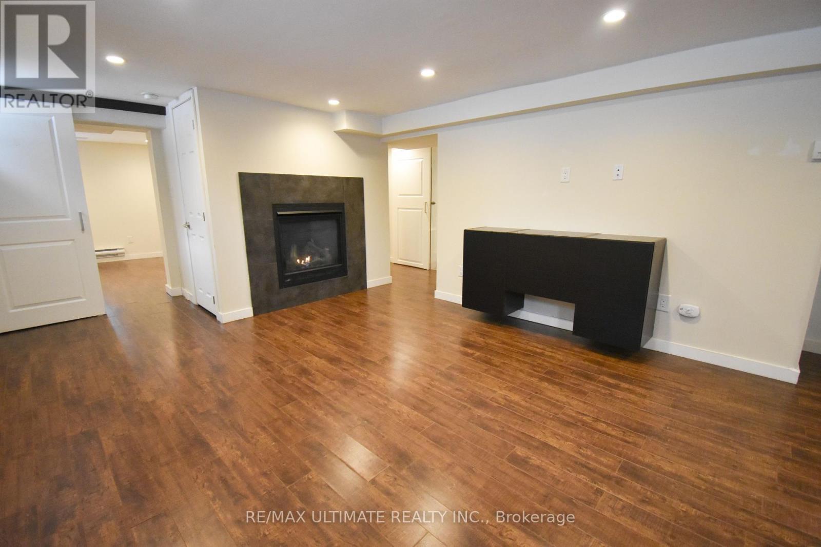 B - 205 Innisfil Street, Barrie, ON - Indoor Photo Showing Other Room With Fireplace