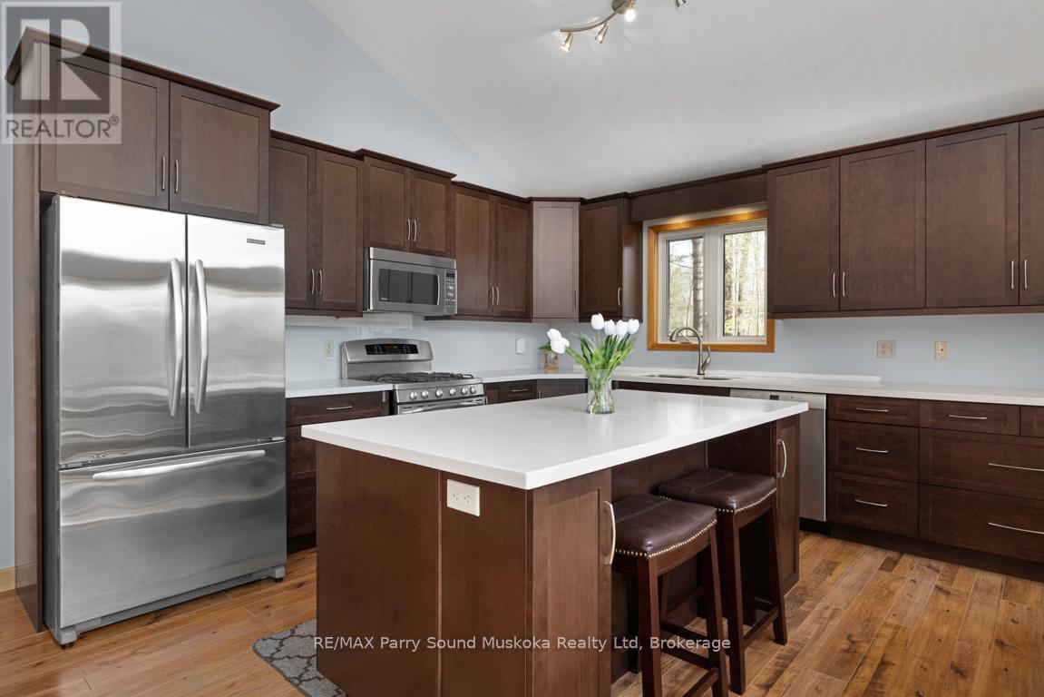Updated kitchen w stainless appliances - 38 Shebeshekong Estates Road S, Carling, ON - Indoor Photo Showing Kitchen