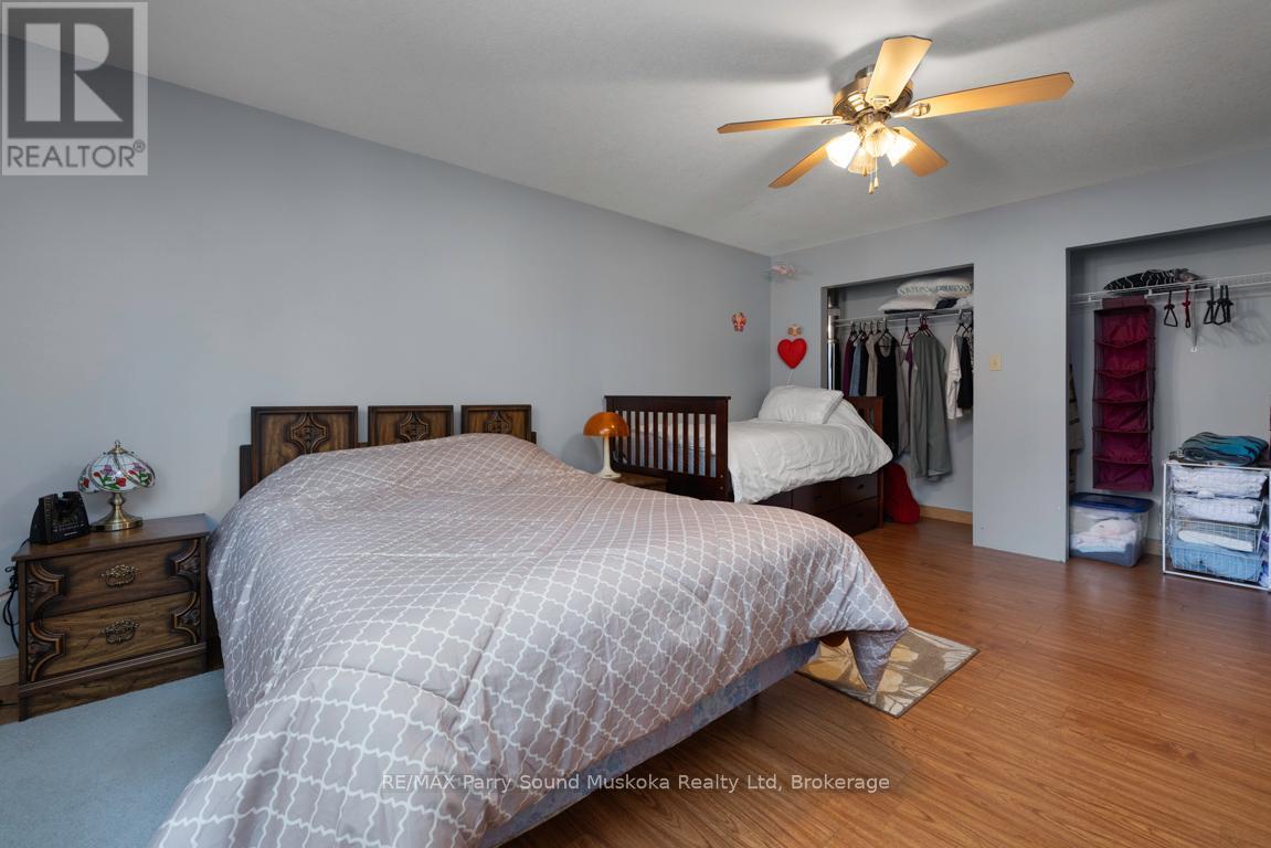 2nd floor Primary bedroom w double closets - 38 Shebeshekong Estates Road S, Carling, ON - Indoor Photo Showing Bedroom