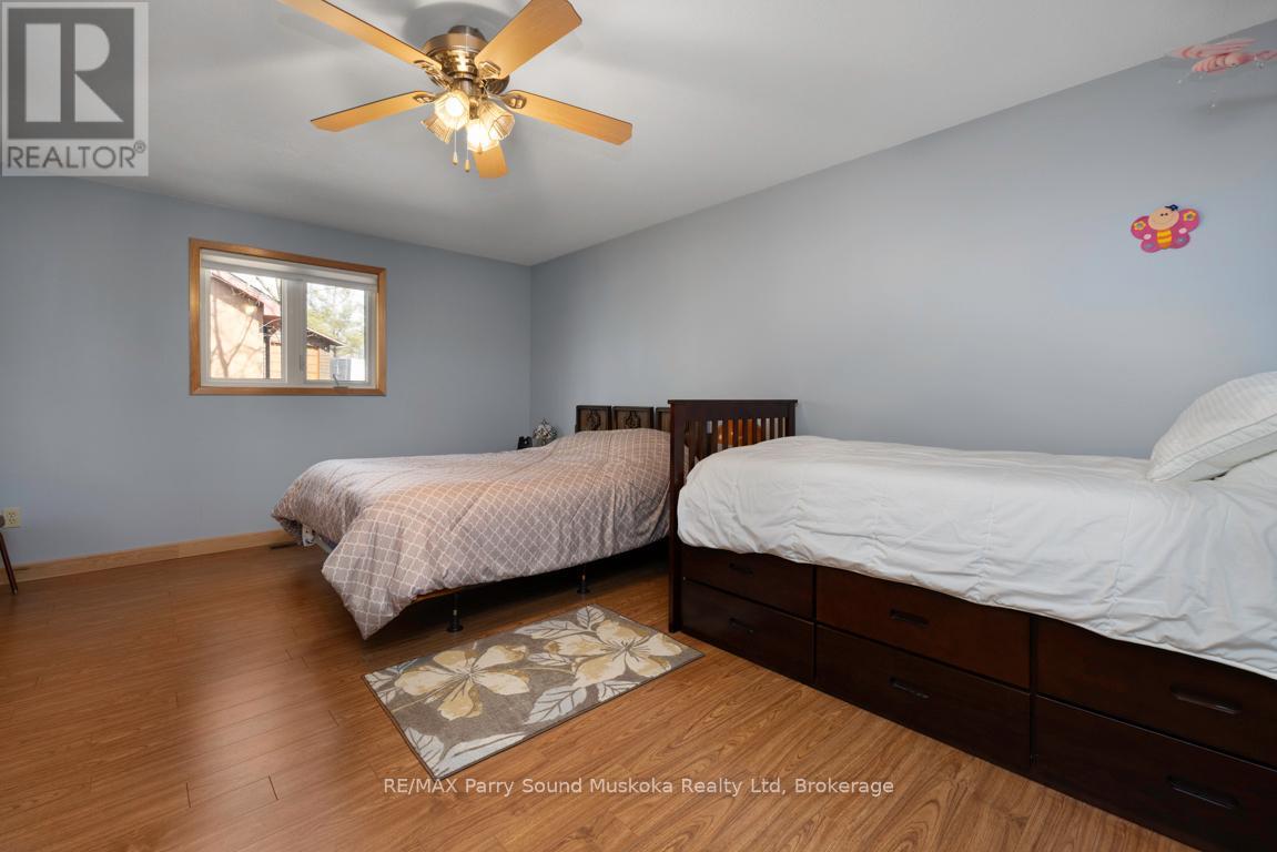 38 Shebeshekong Estates Road S, Carling, ON - Indoor Photo Showing Bedroom