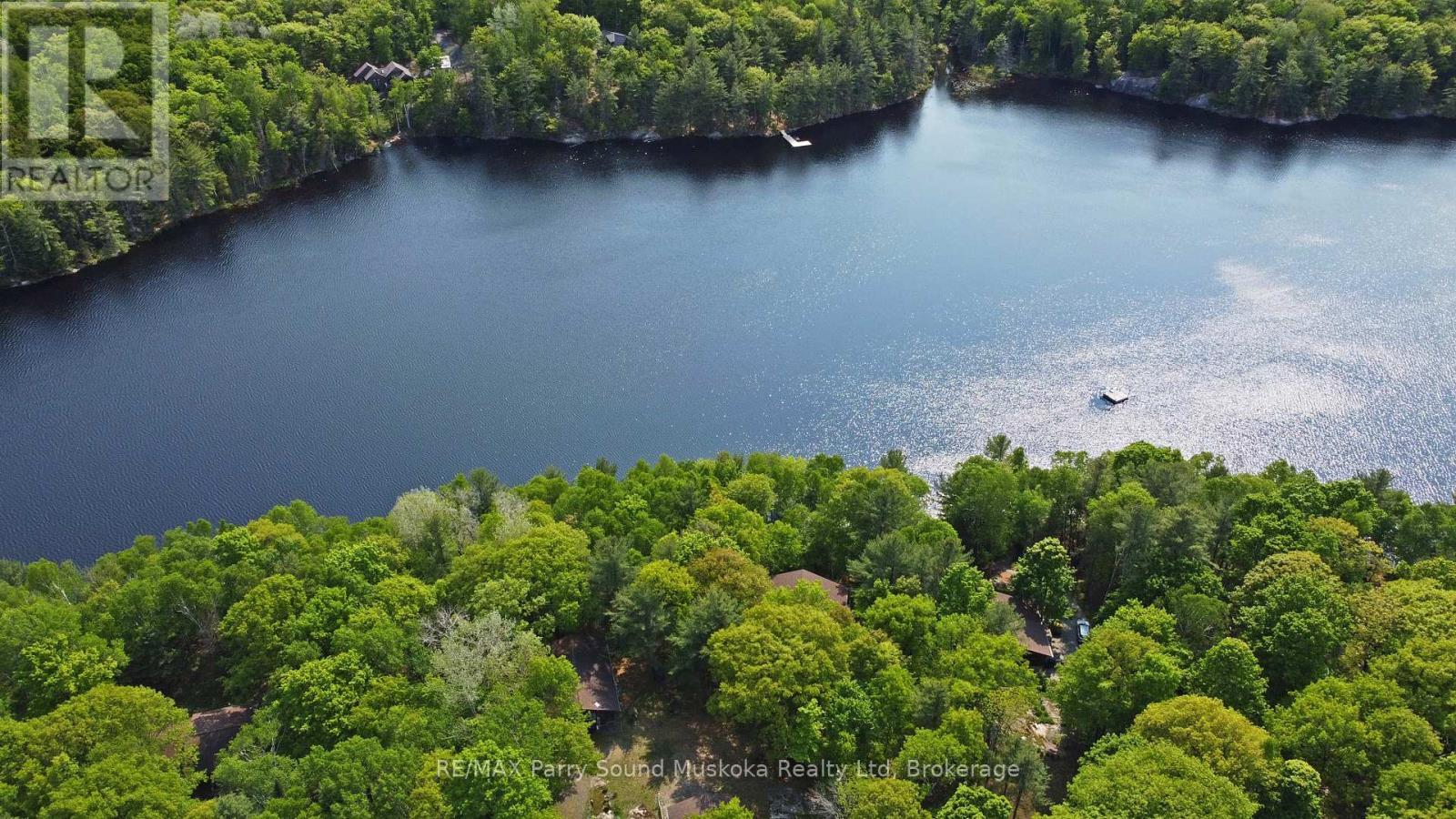 Nestled on 2/3 acre treed lot - 38 Shebeshekong Estates Road S, Carling, ON - Outdoor With Body Of Water With View