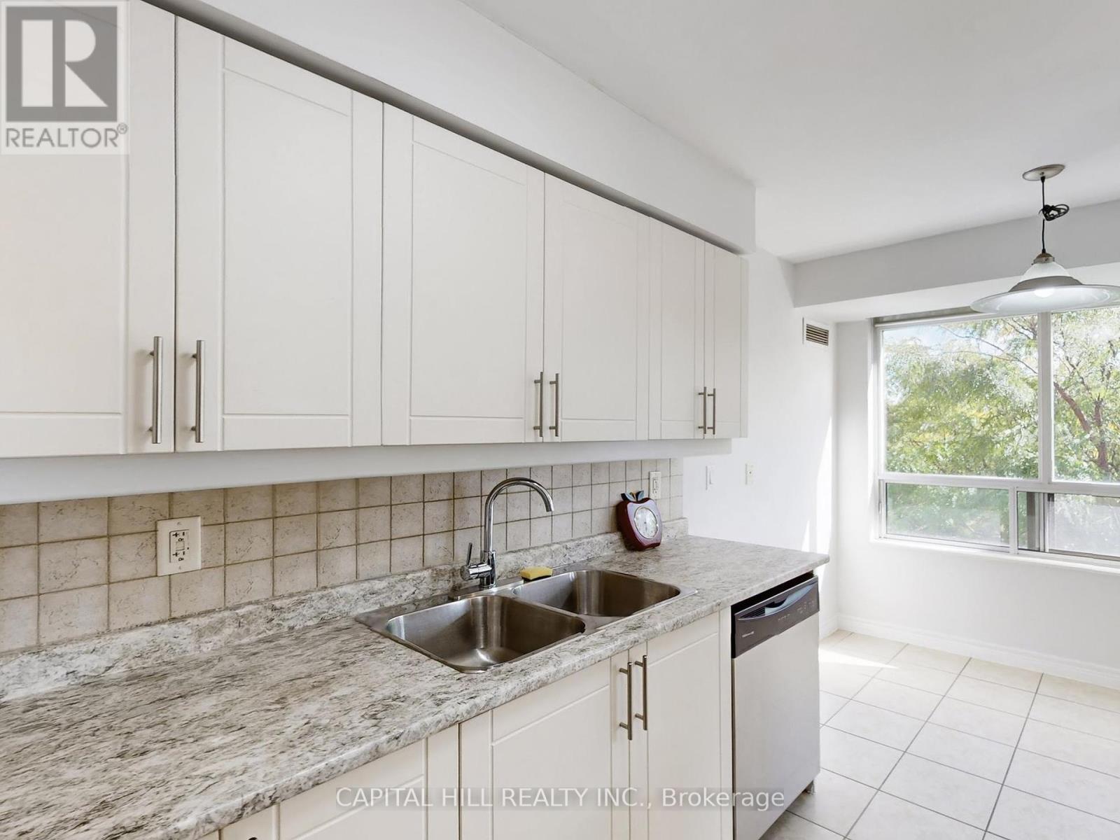 312 - 710 Humberwood Boulevard, Toronto, ON - Indoor Photo Showing Kitchen With Double Sink