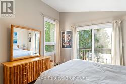 Upper Level Primary Bedroom with Waterviews -