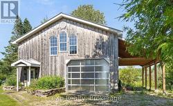 Oversized 30 feet by 30 feet heated garage -